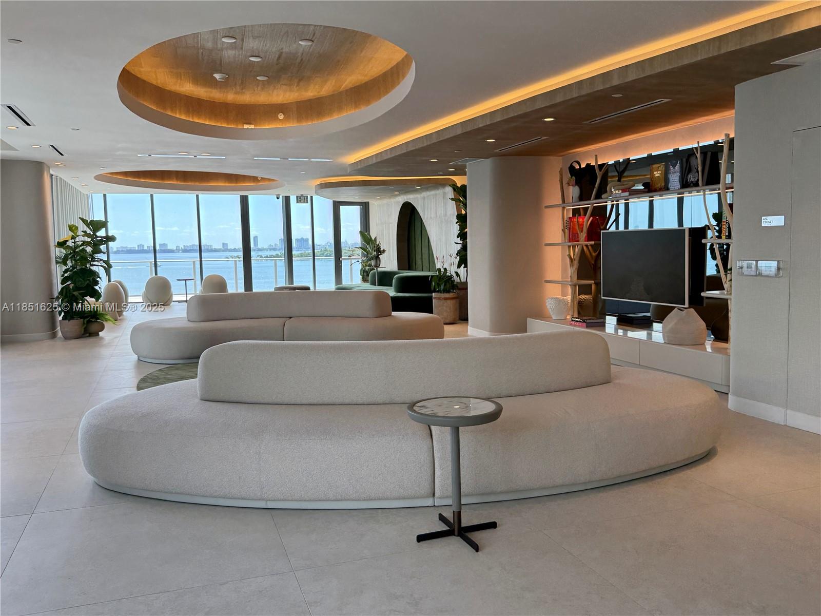 700 Northeast 24th Street, Unit 4305 Miami, FL 33137 - Photo 45 of 54 a living room with furniture and a flat screen tv