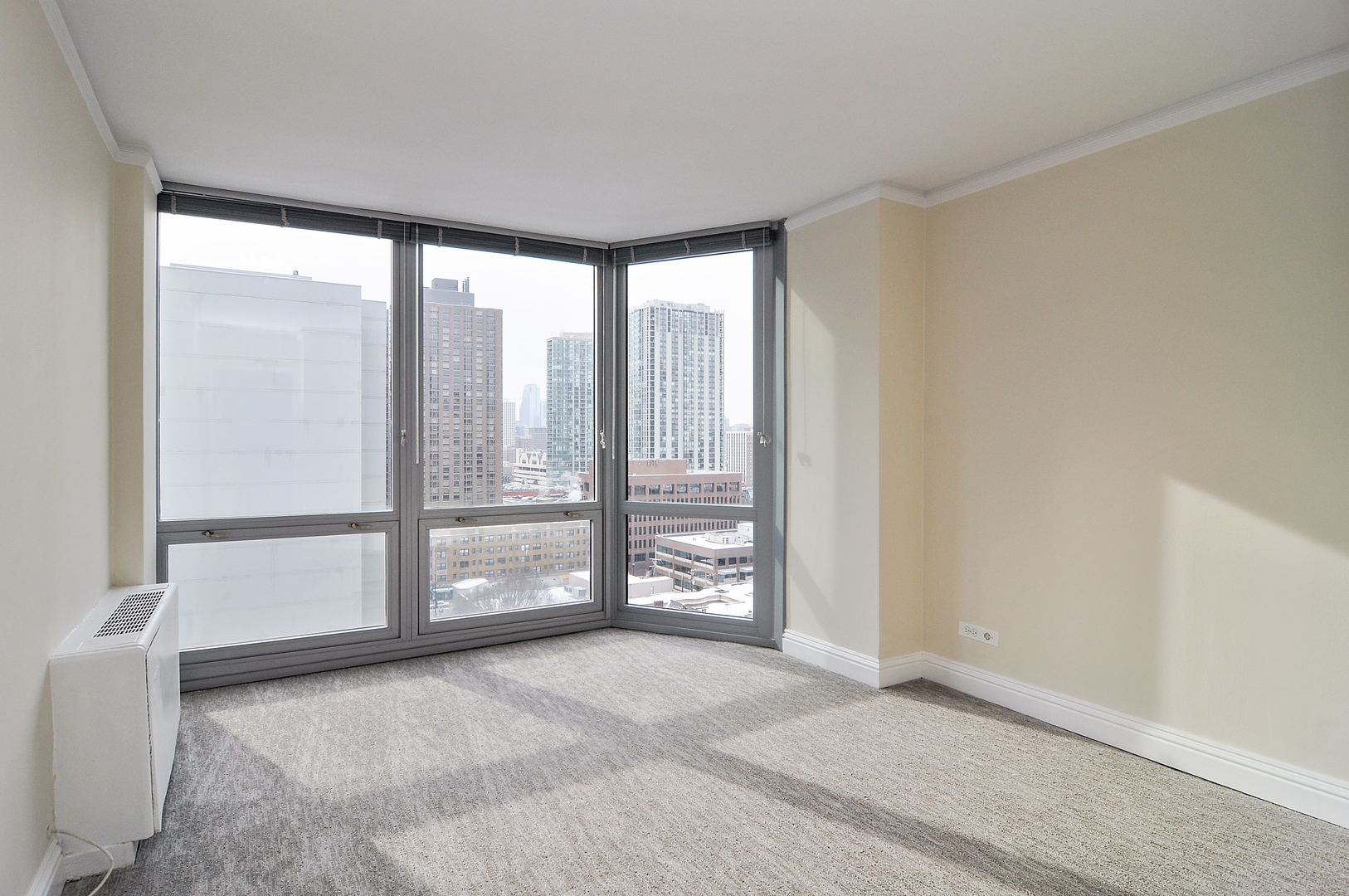 21 West Goethe Street, Unit 16K Chicago, IL 60610 - Photo 6 of 10 a view of an empty room with a window