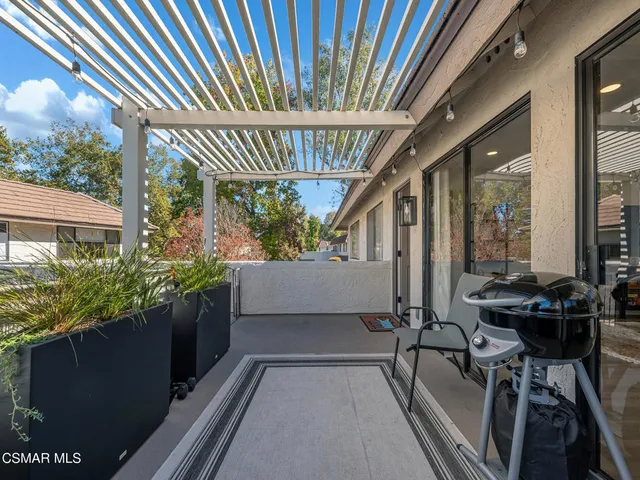 a patio with table and chairs