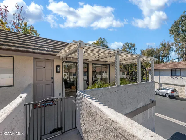 a view of a house with car parked