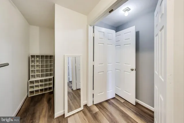a view of livingroom with hardwood floor and hallway