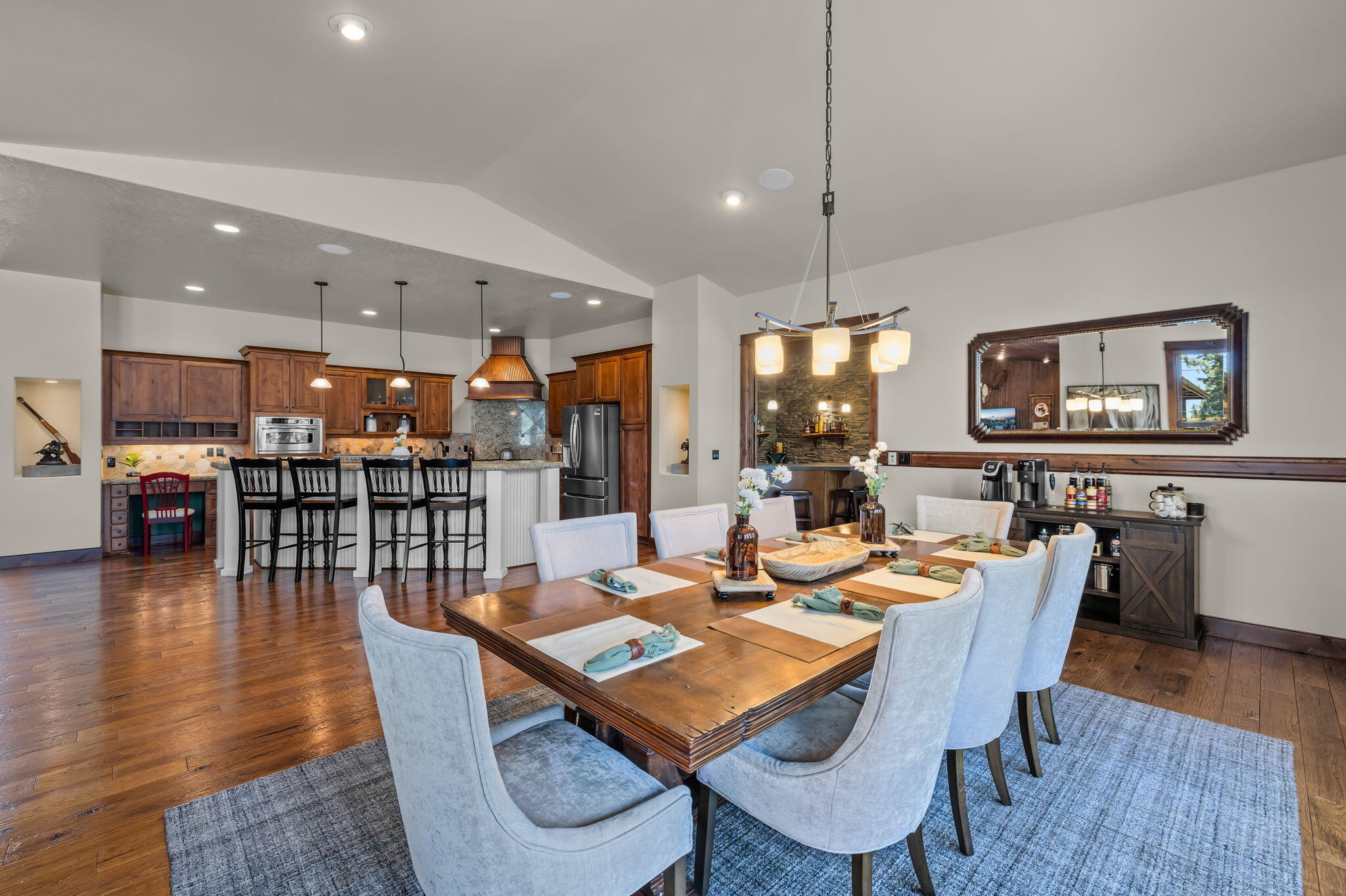 1144 Highland View Loop Redmond, OR 97756 - Photo 14 of 69 a dining room with furniture a rug and wooden floor