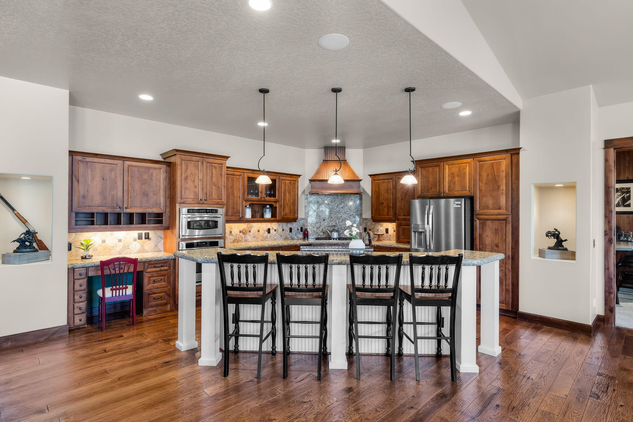 1144 Highland View Loop Redmond, OR 97756 - Photo 3 of 69 a kitchen with stainless steel appliances granite countertop a kitchen island a stove a table and chairs