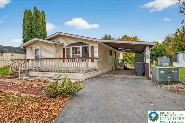 a front view of a house with a porch