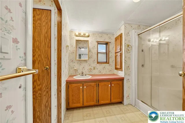 a bathroom with a sink and a mirror