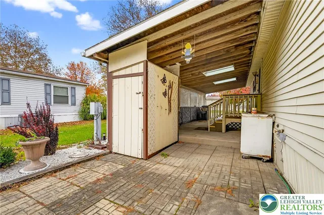 a house that has a tree in front of the house
