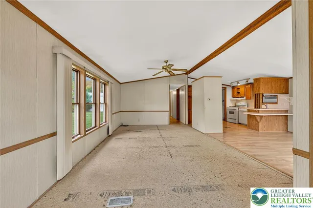 a view of a hallway with wooden walls
