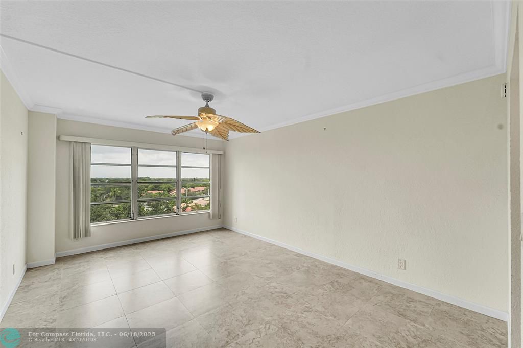 10777 West Sample Road, Unit 805 Coral Springs, FL 33065 - Photo 15 of 34 an empty room with windows and city view