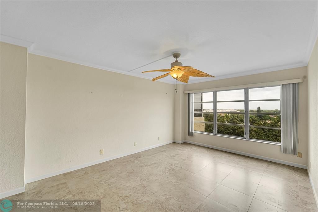 10777 West Sample Road, Unit 805 Coral Springs, FL 33065 - Photo 16 of 34 an empty room with a window