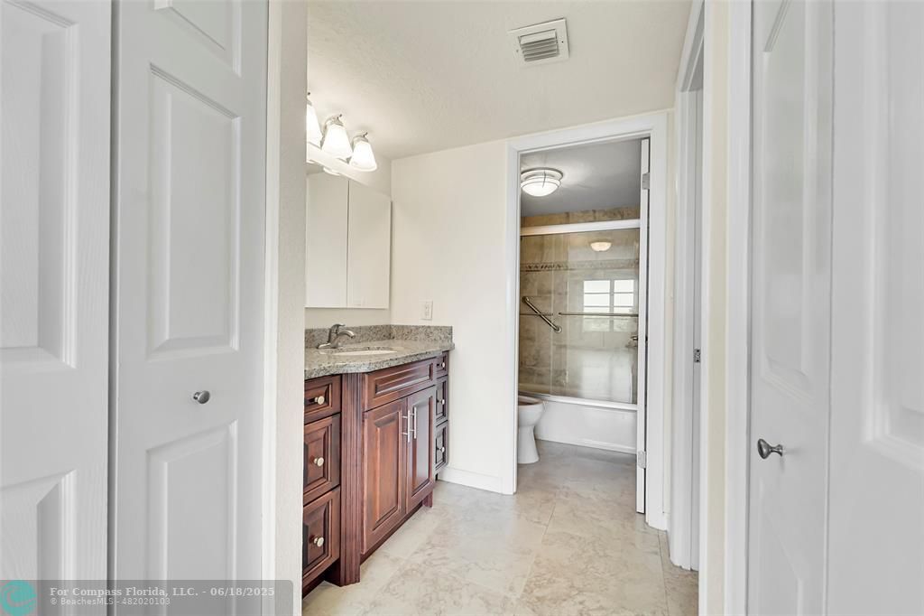 10777 West Sample Road, Unit 805 Coral Springs, FL 33065 - Photo 18 of 34 a view of a hallway and a livingroom with a sink