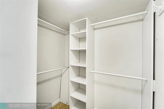 a view of an empty walk in closet