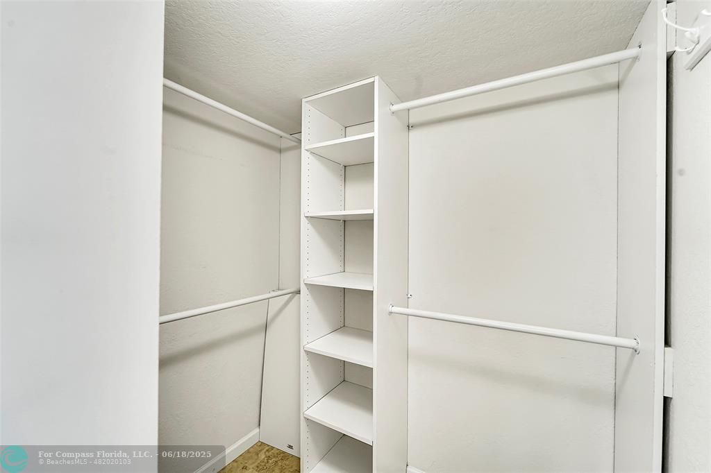 10777 West Sample Road, Unit 805 Coral Springs, FL 33065 - Photo 20 of 34 a view of an empty walk in closet