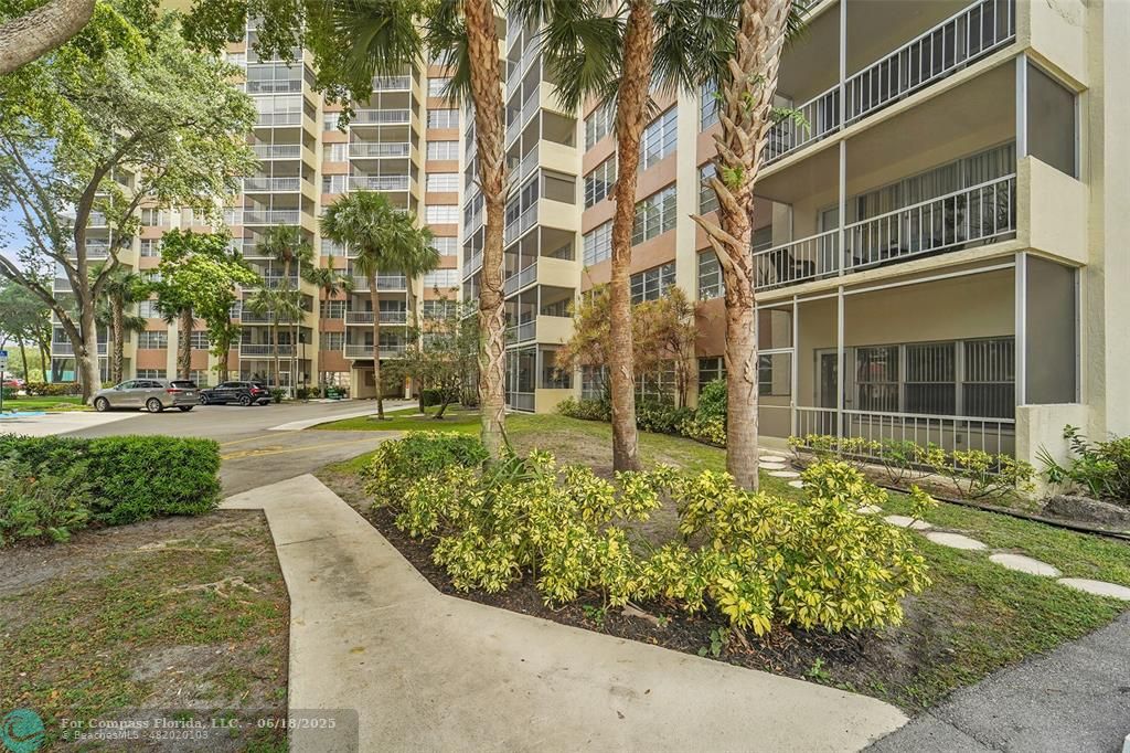 10777 West Sample Road, Unit 805 Coral Springs, FL 33065 - Photo 2 of 34 front view of a building