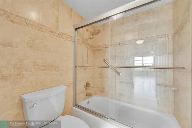 a bathroom with a toilet and a bathtub