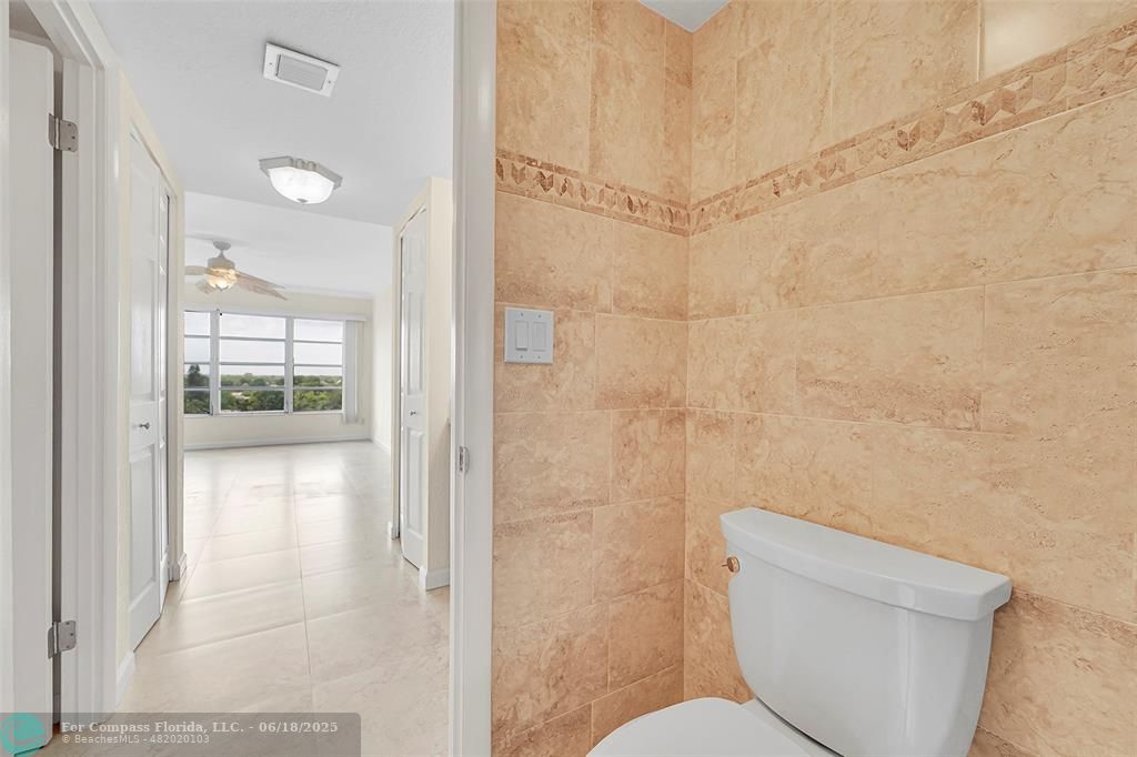 10777 West Sample Road, Unit 805 Coral Springs, FL 33065 - Photo 22 of 34 a bathroom with a toilet and shower