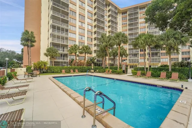 a view of a swimming pool with a patio
