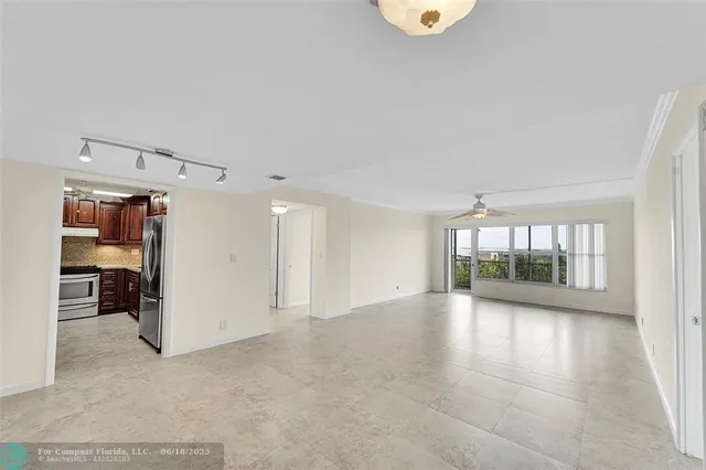 an empty room with a empty space and windows