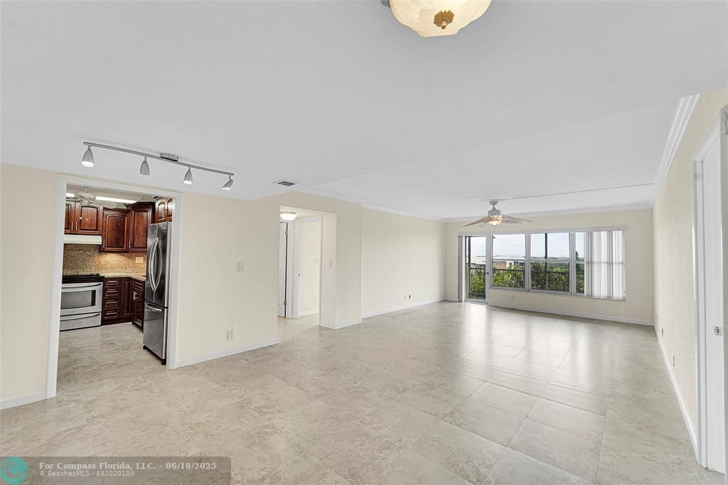 10777 West Sample Road, Unit 805 Coral Springs, FL 33065 - Photo 4 of 34 an empty room with a empty space and windows