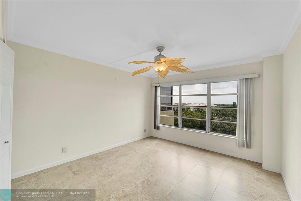 10777 West Sample Road, Unit 805 Coral Springs, FL 33065 - Photo 9 of 34 an empty room with a window