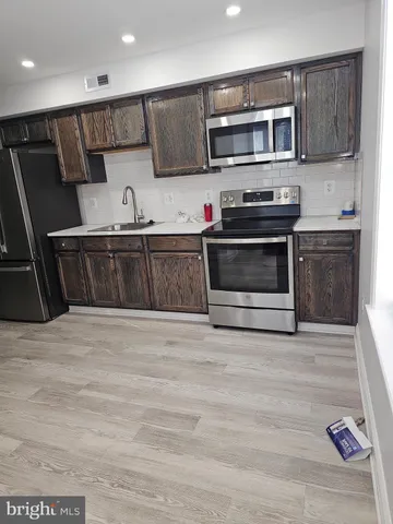 a bathroom with a sink and toilet