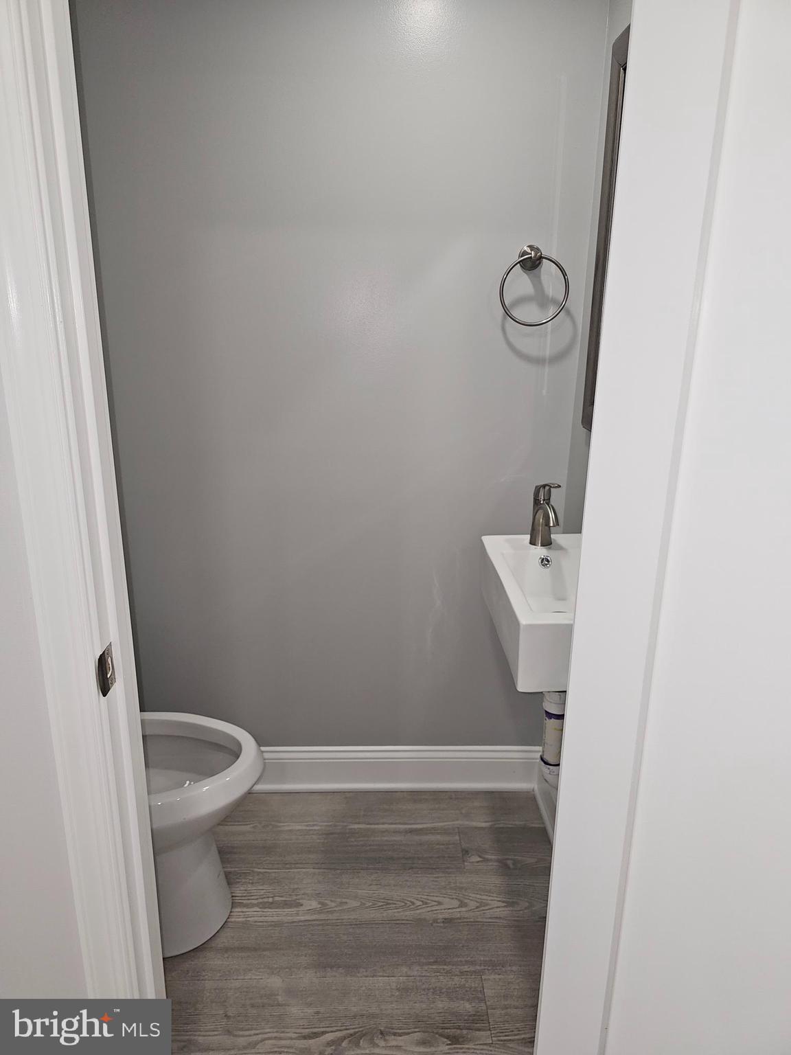 802 Allen Street Cambridge, MD 21613 - Photo 13 of 13 a bathroom with a sink and toilet