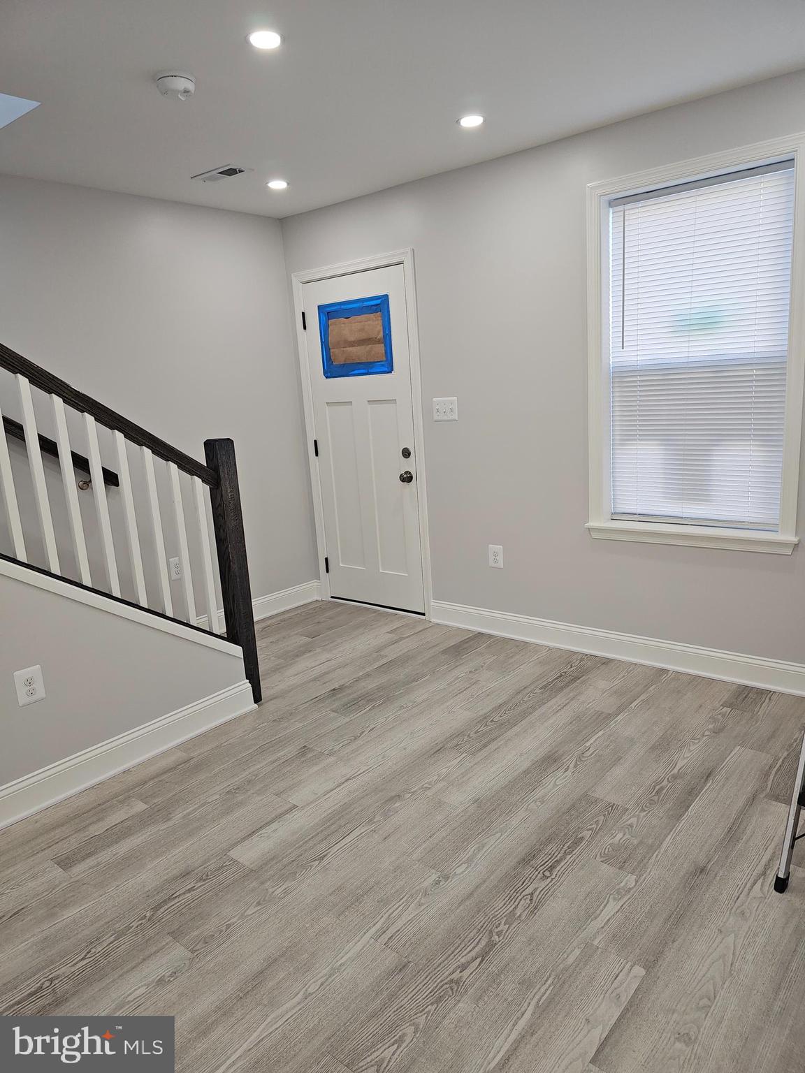 802 Allen Street Cambridge, MD 21613 - Photo 8 of 13 a view of an empty room with wooden floor and a window