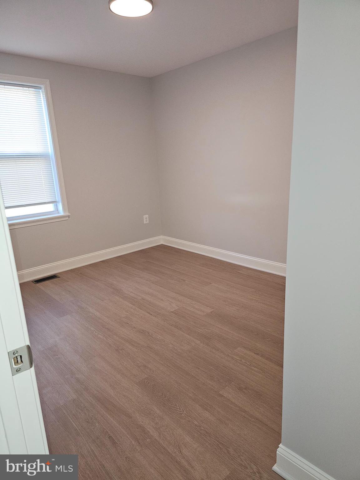 802 Allen Street Cambridge, MD 21613 - Photo 10 of 13 an empty room with windows