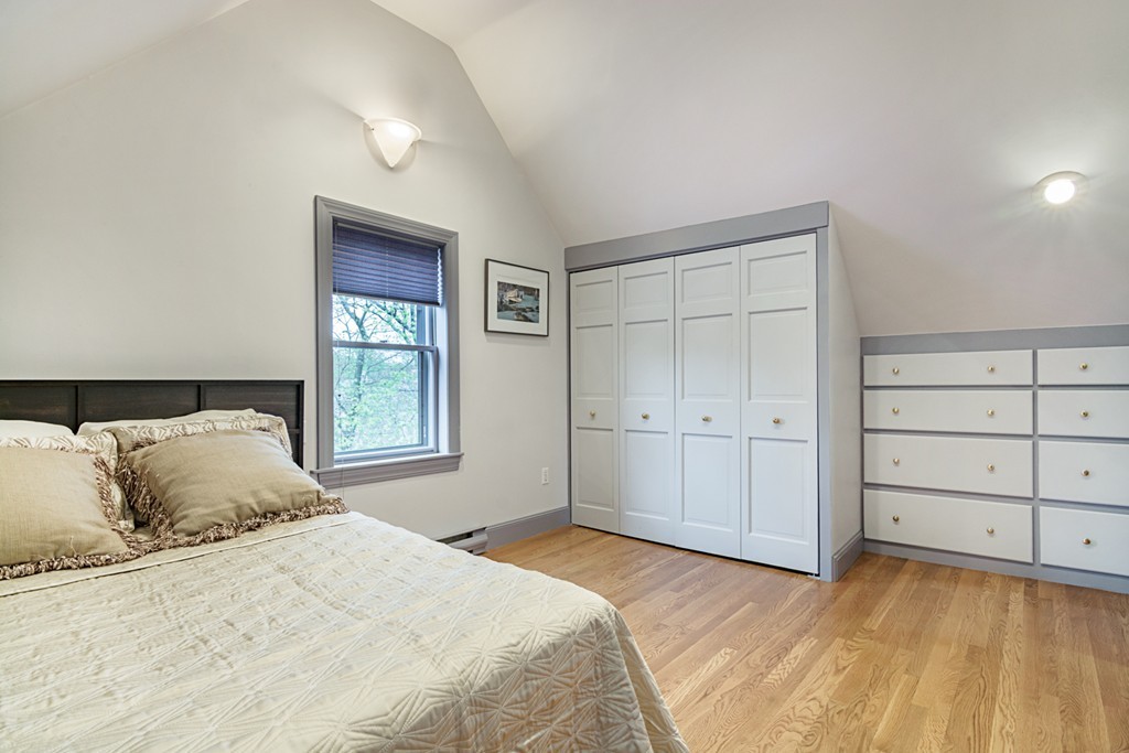 7 Raymond Street Lexington, MA 02421 - Photo 15 of 22 a bedroom with a bed and a window
