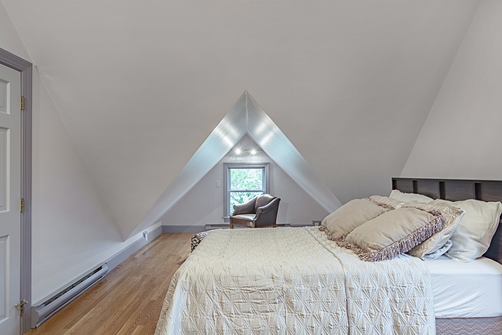 7 Raymond Street Lexington, MA 02421 - Photo 16 of 22 a bedroom with a bed and a large window
