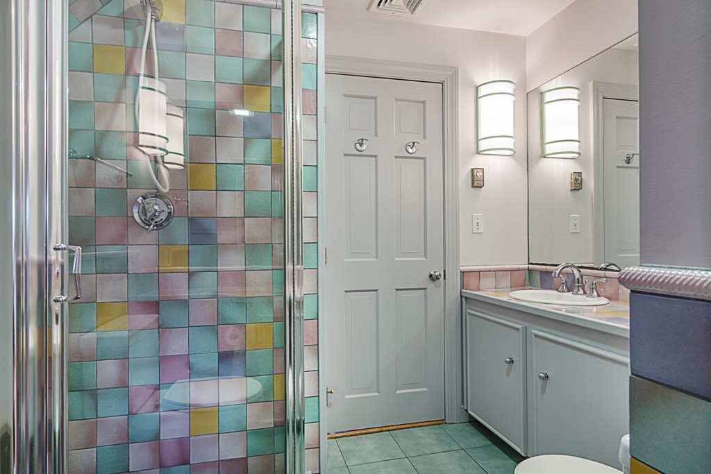 7 Raymond Street Lexington, MA 02421 - Photo 18 of 22 a bathroom with a double vanity sink mirror and shower