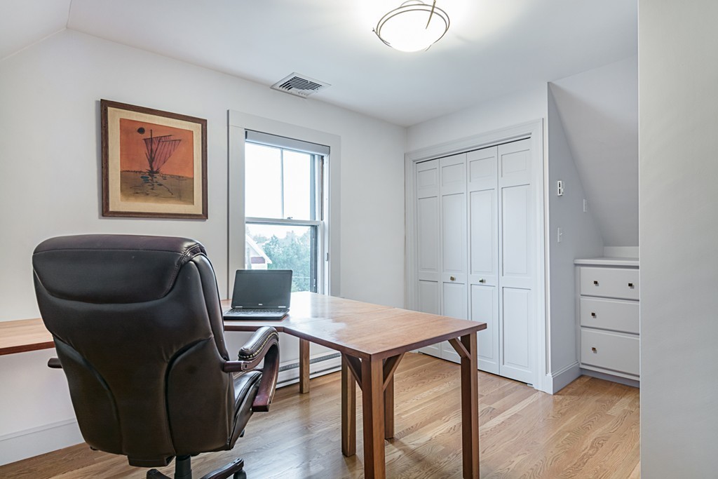 7 Raymond Street Lexington, MA 02421 - Photo 19 of 22 a work room with furniture and windows