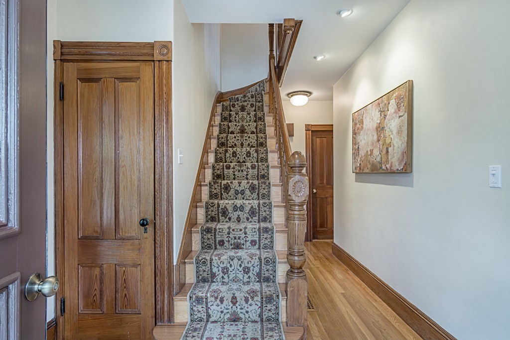 7 Raymond Street Lexington, MA 02421 - Photo 2 of 22 a view of a hallway with wooden floor and entryway
