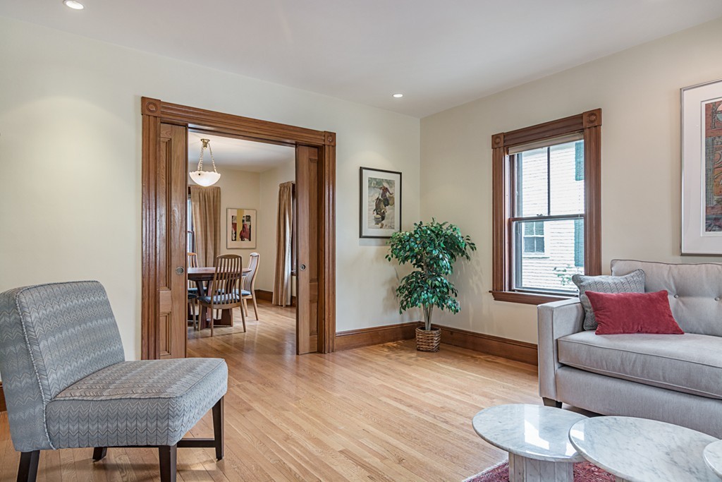 7 Raymond Street Lexington, MA 02421 - Photo 5 of 22 a living room with furniture and a potted plant