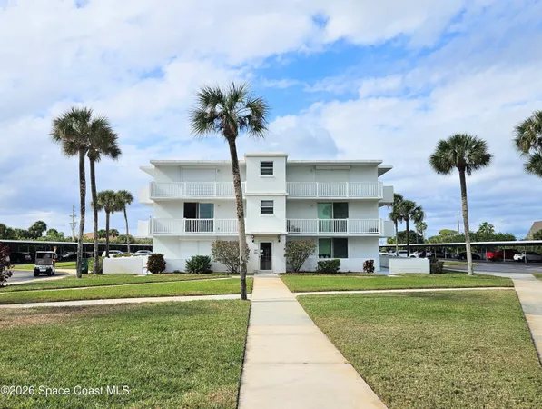 a house with palm tree in front of it