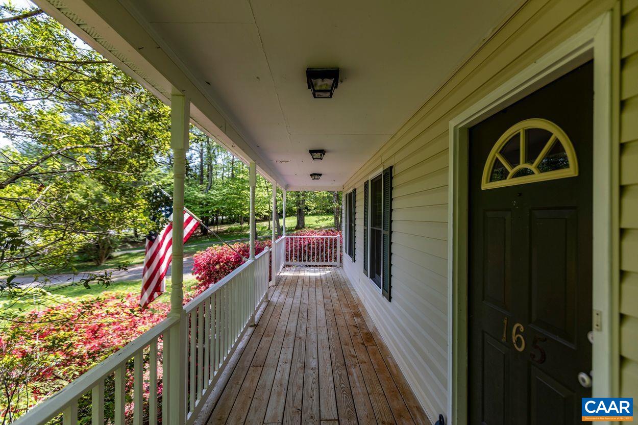 165 Rustling Oaks Way Ruckersville, VA 22968 - Photo 7 of 52 a view of a pathway of a balcony