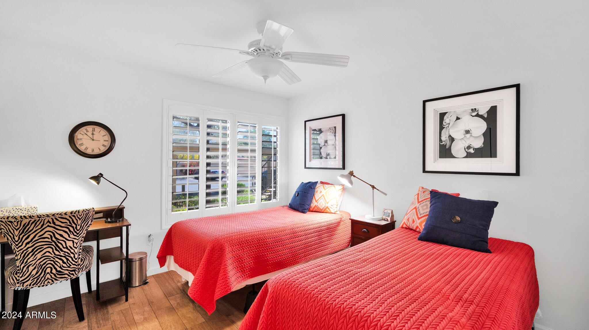 9990 North Scottsdale Road, Unit 1043 Paradise Valley, AZ 85253 - Photo 20 of 28 a bedroom with two beds and a large window