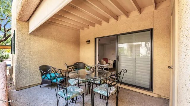 a view of a dining room with furniture and window