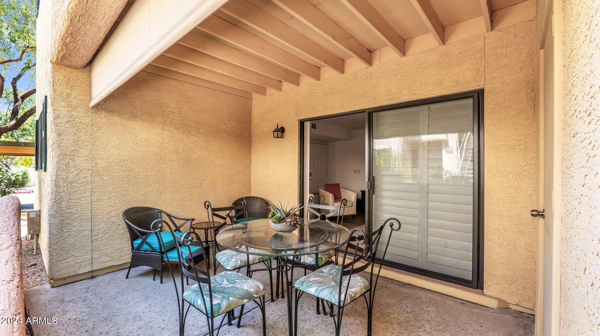 9990 North Scottsdale Road, Unit 1043 Paradise Valley, AZ 85253 - Photo 25 of 28 a view of a dining room with furniture and window