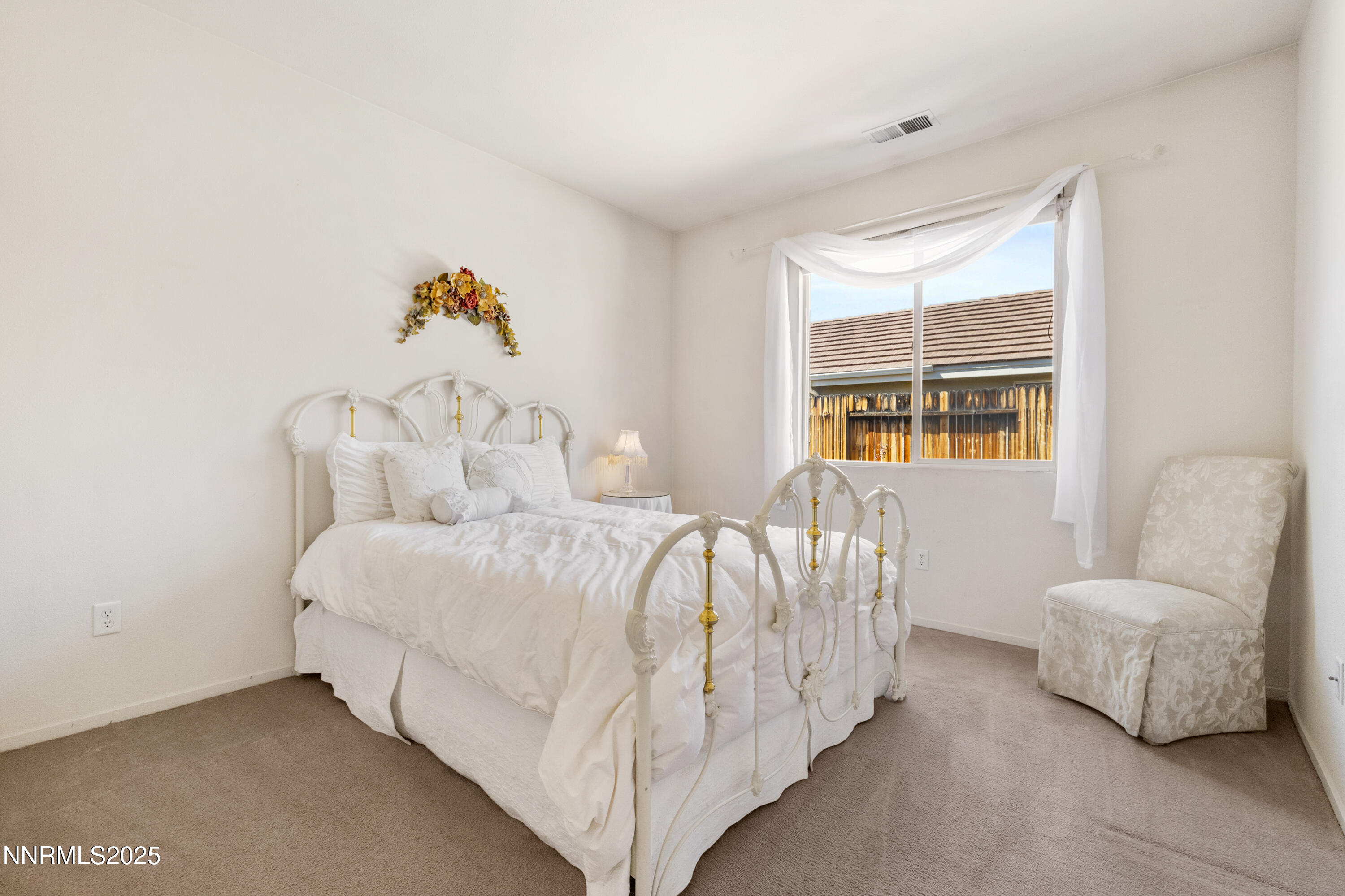1461 Wild Wolf Way Reno, NV 89521 - Photo 15 of 39 a bedroom with a bed and a couch