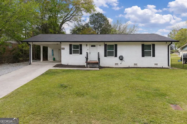 a front view of house with yard and porch