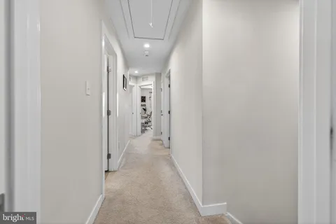 a bed room with a bed and a ceiling fan