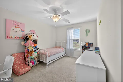 a bed room with a bed and a window