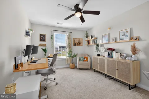 a view of a livingroom with furniture and cabinet
