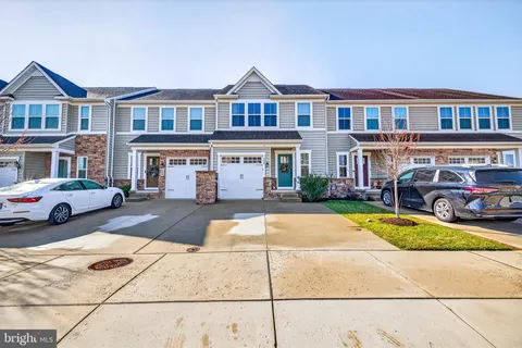 a view of houses with yard and swimming pool
