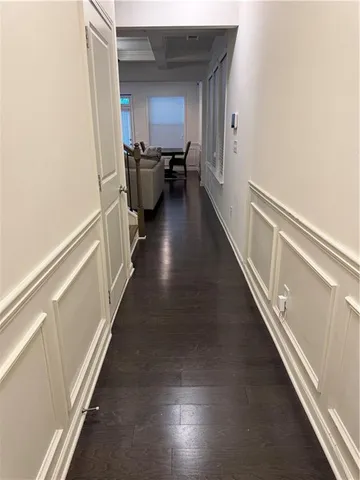 a view of a hallway with the wooden floor