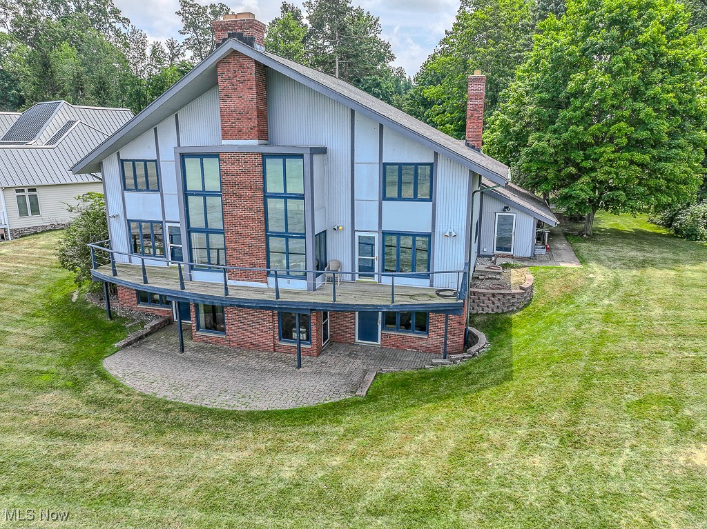 7563 Salida Road Mentor, OH 44060 - Photo 2 of 48 Back of property featuring a chimney, a patio, a yard, and brick siding