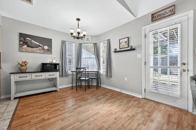 a view of a livingroom with furniture and a flat screen tv
