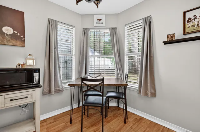 a kitchen with stainless steel appliances granite countertop a sink stove refrigerator and cabinets