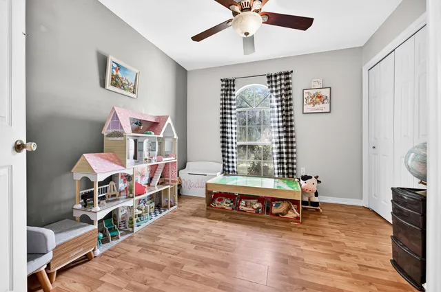 a room with furniture and a wooden floor