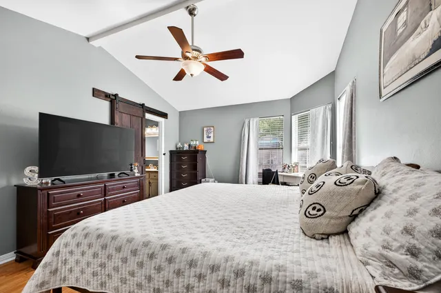 a bedroom with a bed and a table